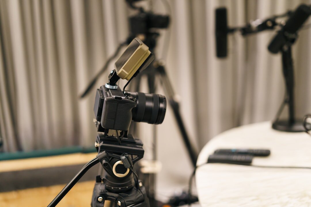 Close up of a microphone and camera during a filmed interview