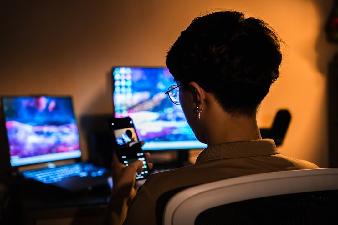 Technician monitoring video and audio feeds on multiple screens during a shoot